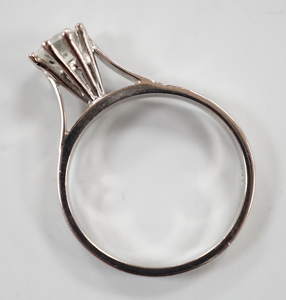 An 18ct white metal and solitaire diamond set ring, size Q, gross weight 4.6 grams, the stone measuring 6.3mm in diameter.